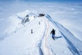 Skier skiing with helmet alone on the ski slope towards Matterhorn mountain on a beautiful sunny day in Switzerland Royalty Free Stock Photo