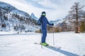 Male skier skiing on snow covered landscape against Matterhorn mountain range Royalty Free Stock Photo