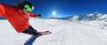 Skier skiing on a sunny day in high mountains on ski slope