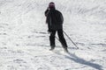 Skier sliding down on hillside