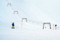 Skier in the snow at the ski lift in the mountains, copy space