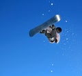 Skier Snowboarder jumping through air with sky in background Royalty Free Stock Photo