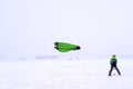 Snowkiter prepares to start during a snowfall