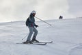 Skiing in the winter snowy slopes Royalty Free Stock Photo