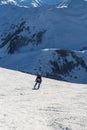 Skier standing in front of mountains Royalty Free Stock Photo