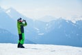 Skier taking photos from the top at Madonna di Campiglio Ski Resort in Italy, Europe.