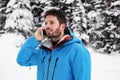 Skier talking on mobile phone