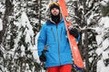 Skier walking on snow covered mountains Royalty Free Stock Photo