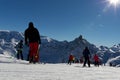 Skiers on beautiful ski slope in Alps, people on winter holidays. Winter mountain landscape Royalty Free Stock Photo