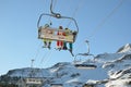 Skiers in the chair lift above the snow hill