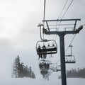 Skiers on chairlift. Royalty Free Stock Photo