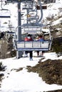 Skiers on chairlift