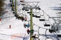 Skiers on the chairlift on the Italian Alps