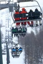 Skiers on the chairlift on the Italian Alps
