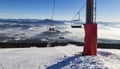 Skiers on the chairlift. Ski trails Royalty Free Stock Photo