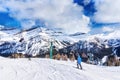 Skiers on Chairlift Up a Ski Slope in the Canadian Rockies Royalty Free Stock Photo