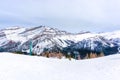 Skiers on Chairlift Up a Ski Slope in the Canadian Rockies