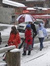 Skiers come back to town in a snowstorm