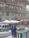 Skiers come back to town in a snowstorm