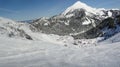 Skiers descend to tiny mountain village Royalty Free Stock Photo