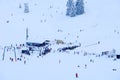 Skiers dot the mountainside above the village of Bayrischzell, Germany Royalty Free Stock Photo