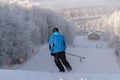 Skiers are down the hill, winter day, Moscow region, Russia Royalty Free Stock Photo