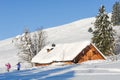 Skiers Finish a Day of Skiing on a Pristine Slope