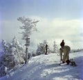 Skiers Getting Ready at the Top of the Mountain