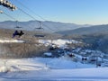 Skiers getting up at the chair lift at ski resort Royalty Free Stock Photo