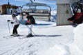 Skiers going up with a ski lift in the Alps