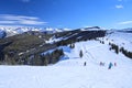 Skiers high in the Rocky Mountains of Vail, Colorado in winter