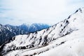 Skiers on ice-covered mountains near the river in the cold Royalty Free Stock Photo