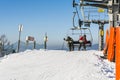 Skiers leave the chairlift. Royalty Free Stock Photo