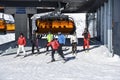 Skiers leaving chairlift Royalty Free Stock Photo