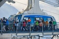 Skiers with medical masks exit the Urdenbahn cable car at the Arosa Lenzerheide ski resort, part of Covid-19 regulations.