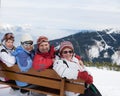 Skiers mountains in the background