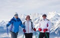 Skiers mountains in the background