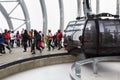 Skiers out of cabin of cable car
