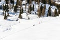 Skiers on a path, Cuneaz (Italy)