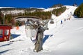 Skiers on platter lift and in resort Chopok Juh in Slovakia