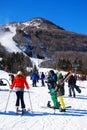 Skiers prepare themselves to take on the highest peak at a resort Royalty Free Stock Photo