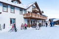 Skiers put their skis near the main building of the resort