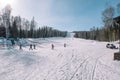 Skiers ride from the mountain. Ski resort. Winter in Siberia. Winter landscape. Beautiful nature