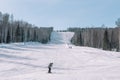 Skiers ride from the mountain. Ski resort. Winter in Siberia. Winter landscape. Beautiful nature