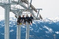 Skiers riding on ski lift in Whistler, Canada