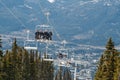 Skiers riding on ski lift in Whistler, Canada Royalty Free Stock Photo