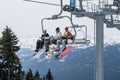 Skiers riding on ski lift in Whistler, Canada. Royalty Free Stock Photo