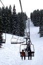 Skiers Riding Up a Chair Lift Royalty Free Stock Photo