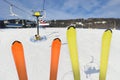 skiers sit on the lift and show their skis. skiing on the background of the winter landscape of the ski resort Royalty Free Stock Photo