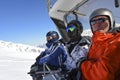 Skiers sitting in chairlift